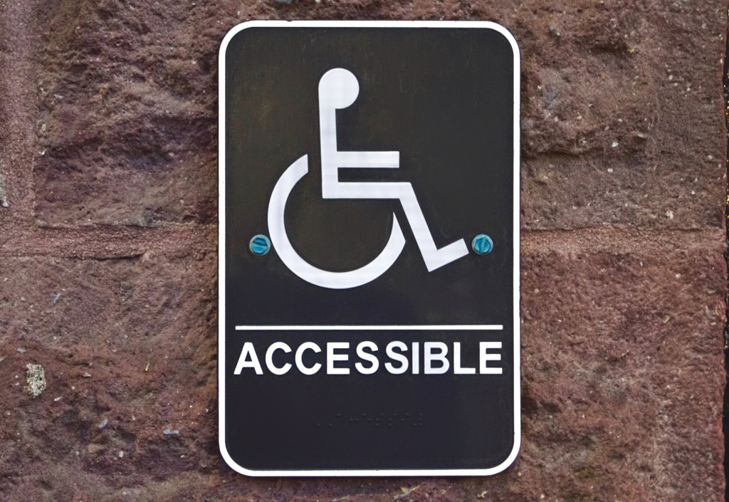 Wheelchair accessibility symbol, highlighting the importance of ADA compliance in supporting everyday people around us